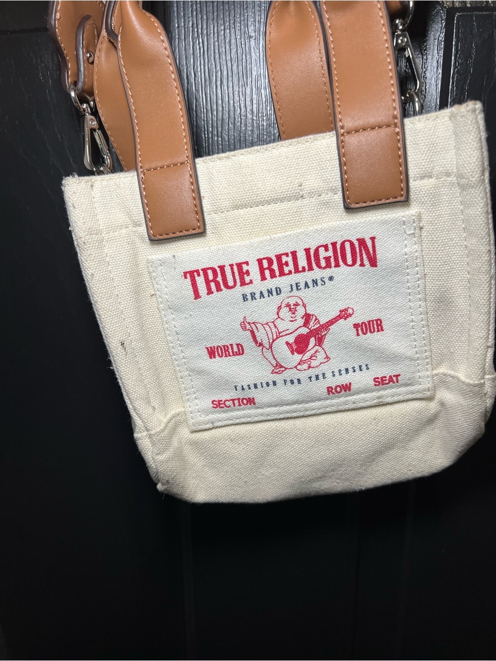 True Religion Cream Canvas Tote with Brown Leather Handles and Red Logo